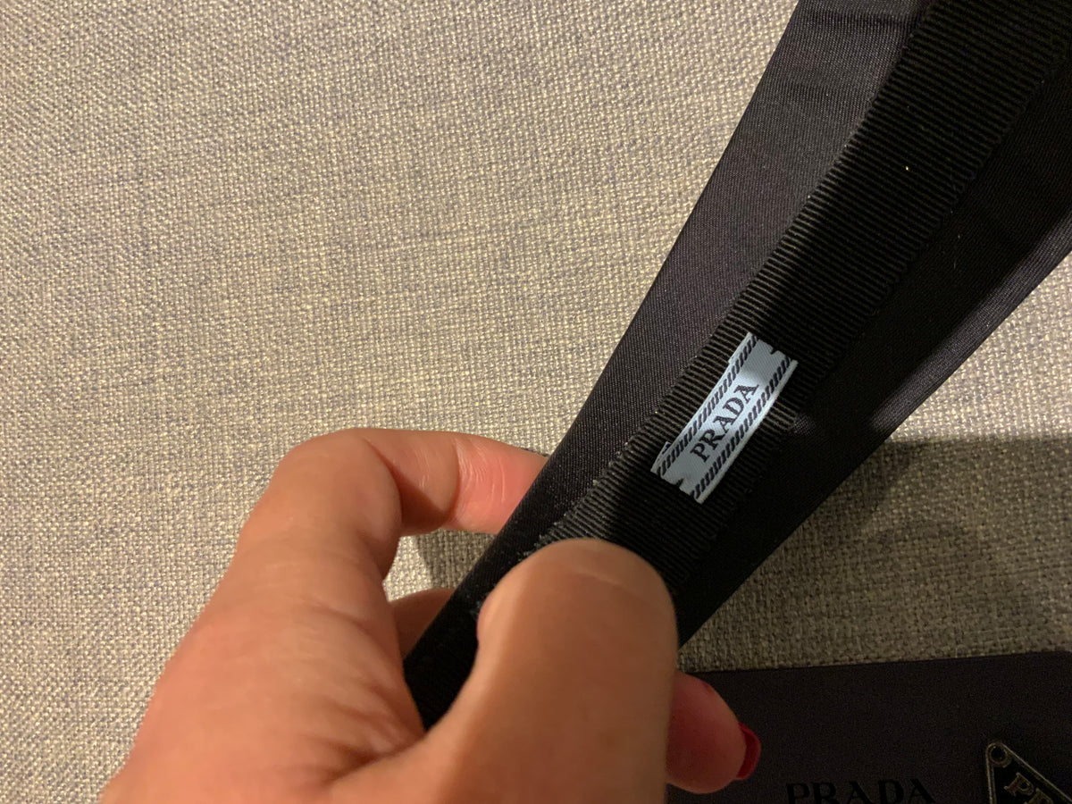 Prada headband with signature triangle and logo at top ladies