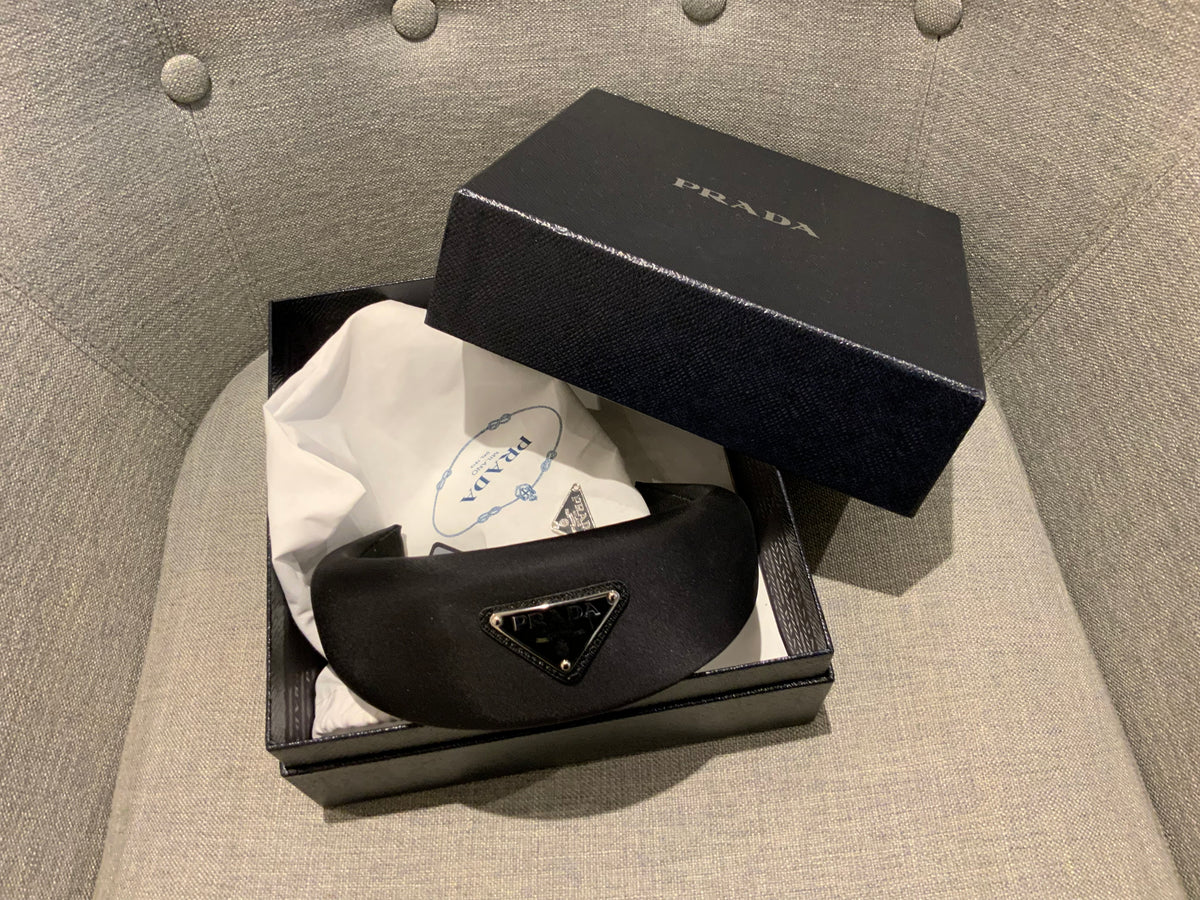 Prada headband with signature triangle and logo at top ladies