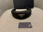Prada headband with signature triangle and logo at top ladies
