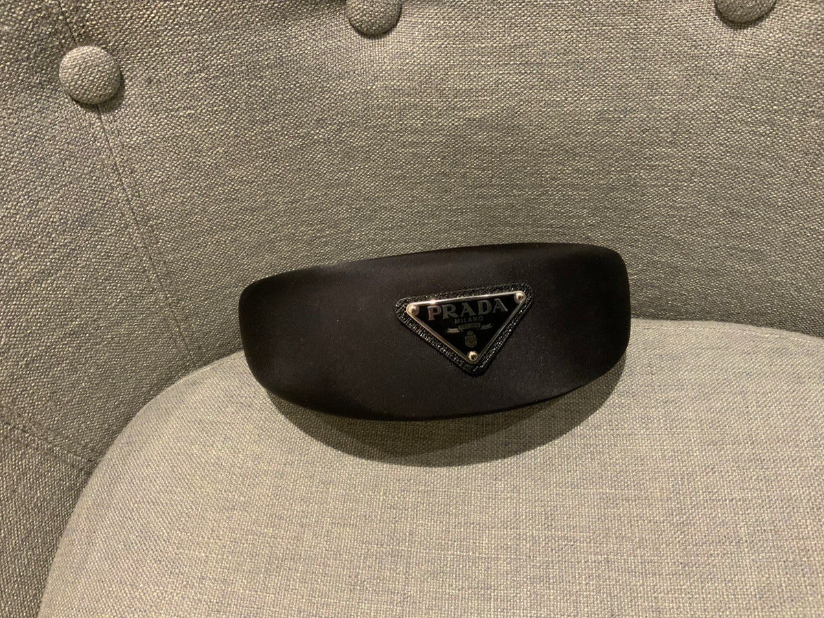 Prada headband with signature triangle and logo at top ladies